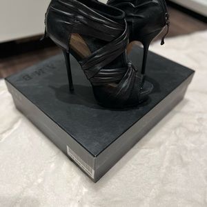 Lamb Crepe black leather booties in size 7M.